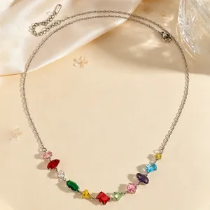Detailed view of a silver necklace featuring a vibrant array of multi-colored zircon stones