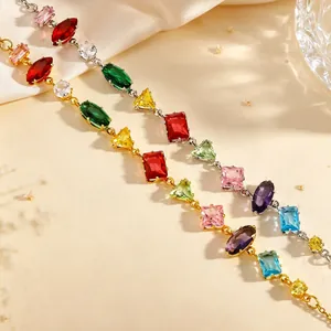 Macro detail of elegant necklaces featuring vibrant multi-colored zirconia gemstones