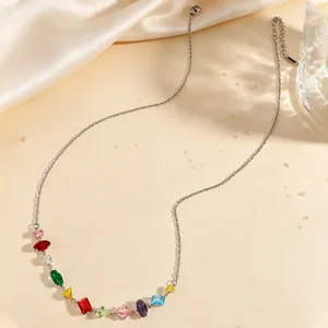 Detailed view of elegant silver chain necklace with multi-shaped colorful zircon gemstones.