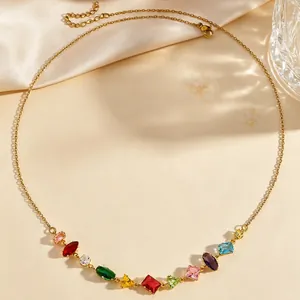 Detailed view of dainty gold choker necklace with vibrant multi-colored gemstones