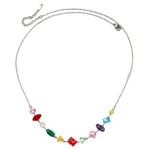 Detail of multi-colored zircon necklace with diverse gemstone shapes and silver chain