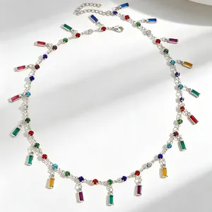 Detailed view of silver chain necklace featuring multi-colored rectangular zircons