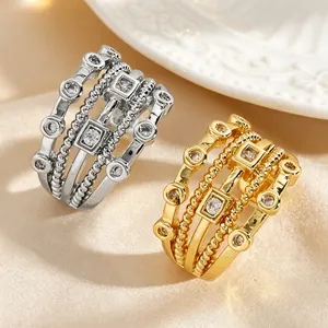 Macro view of vintage multi-layer hollow ear cuffs in gold and silver with zircons