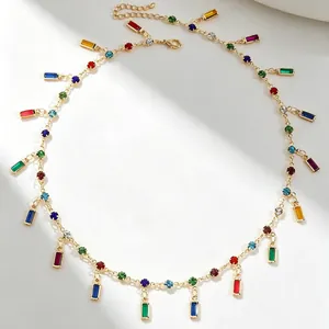 Detailed view of colorful gemstone necklace with gold-plated chain and vibrant charms