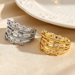 Macro detail of vintage multi-layer hollow zircon ear cuffs in gold and silver finish