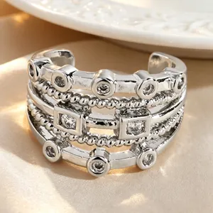 Macro detail of vintage multi-layered hollow silver ear cuff set with sparkling zircons