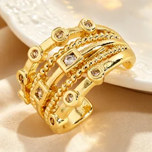 Macro view of vintage gold multi-layer ear cuff featuring sparkling zircon stone settings