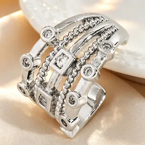 Detailed macro view of multi-layer silver hollow cubic zirconia ear cuff jewelry for women