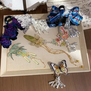 Variety of Chinese style embroidered butterfly hair clips with elegant tassels and bells.