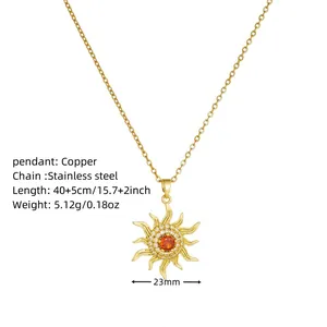 Detail view of sunburst pendant necklace with red gemstone and stainless steel chain