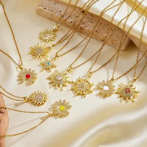 Elegant gold-plated sun star and flower pendant necklaces displayed on premium silk fabric