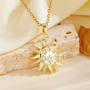 Close-up view of a gold sunburst pendant featuring star patterns and shimmering crystals