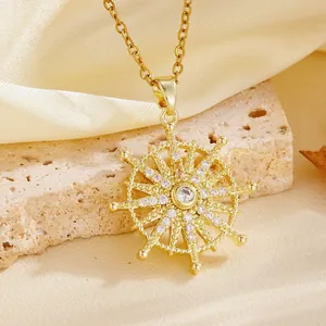 Macro detail of golden sunburst pendant necklace with sparkling stones on stone base