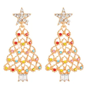 Close-up of gold Christmas tree earrings with colorful rhinestones and star top for women