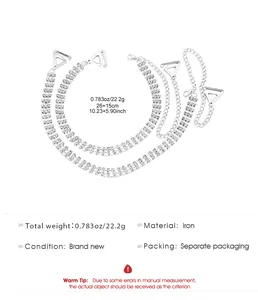 Detail view of silver rhinestone bra straps showing weight and material specifications