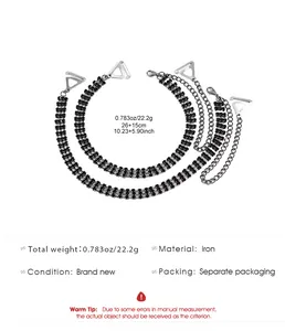 Detail showing black rhinestone bra straps with adjustable silver metal chain and clips.