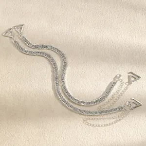 Elegant detail showing double row rhinestone bra straps with adjustable silver chains