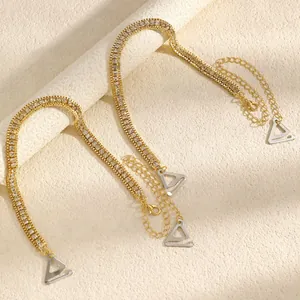 Close-up of elegant rhinestone bra straps with golden finish and metal hooks