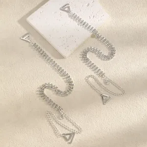 Detailed close-up showing multi-row crystal rhinestone bra straps with silver metal hooks