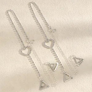 Close-up of decorative silver bra straps with sparkling heart-shaped rhinestone details