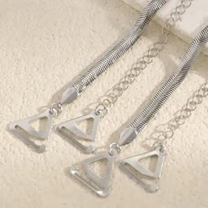 Detail view of stylish silver metal bra strap hooks featuring snake and link chain designs