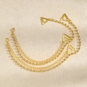 Detailed view of dual-layer gold rhinestone decorative bra straps with triangular hooks