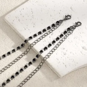Detailed close-up view of elegant black rhinestone bra straps with secure lobster clasp