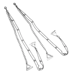 Detailed view of silver decorative bra straps featuring delicate rhinestone chains and triangle buckles