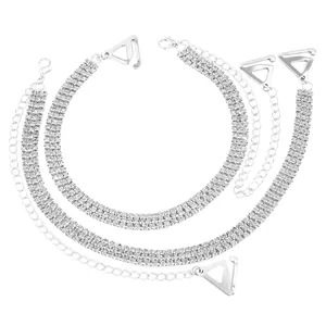 Detail of elegant silver three-row rhinestone bra straps for off-shoulder dresses.