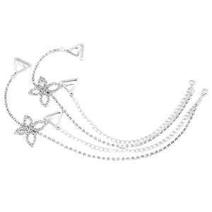 Detail showing elegant silver floral rhinestone bra straps with multiple chain layers.