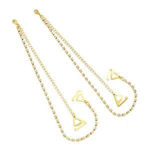 Macro view of adjustable gold bra straps with sparkling rhinestones for fashion tops