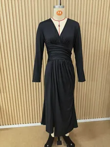 Elegant V-neck long sleeve black midi dress featuring a stylish ruched waist and irregular hem