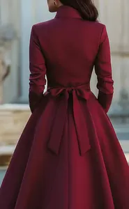 Elegant burgundy long sleeve dress with waist bow tie back view detail photography.