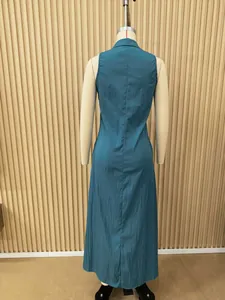 Detail view of the back of a sleeveless teal maxi dress on a professional mannequin.