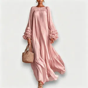 Detail of tiered ruffle sleeves on a dusty pink maxi dress for a feminine look.