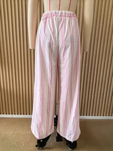 Rear view of pink and white vertical striped wide-leg trousers on a mannequin