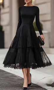 Elegant French Hepburn style black midi dress with tiered mesh lace patchwork details