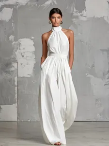 Elegant white halter neck backless wide-leg jumpsuit with floor-length silhouette