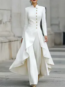 Elegant white high-neck pantsuit set with gold buttons and asymmetric skirt overlay