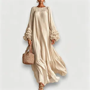Detail view of long sleeve maxi dress with ruffled tiered sleeves in beige