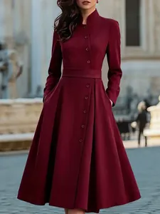 Sophisticated wine red long sleeve midi dress featuring decorative buttons and a waist belt