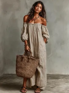 Full view of elegant off-the-shoulder striped maxi dress for a bohemian summer look