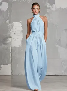 Elegant light blue halter neck wide-leg jumpsuit with a backless design for parties
