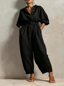 Elegant black V-neck belted jumpsuit with long sleeves for sophisticated women's casual wear.