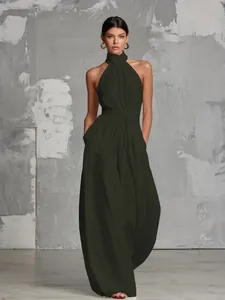 Elegant olive green halter neck wide-leg jumpsuit with a backless and sleeveless design.
