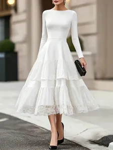 Elegant white French Hepburn style long sleeve dress with tiered lace mesh skirt.