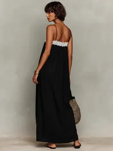 Elegant black maxi dress with white lace trim and thin spaghetti straps for summer