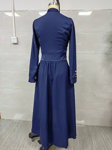 Detailed back view of an elegant navy blue long-sleeve maxi dress displayed on a mannequin.