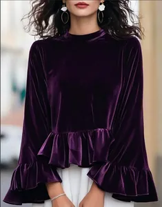 Elegant dark purple velvet blouse featuring bell sleeves and a stylish ruffle hem