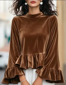 Detailed view of brown velvet long sleeve top featuring ruffle hem and flare sleeves